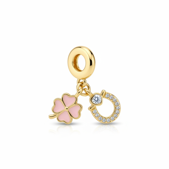 Charm dorado con trébol rosa y herradura con circonitas, en acero con baño de oro 18K