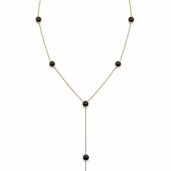 Collar lariat dorado con discos negros esmaltados en acero con baño de oro 18K