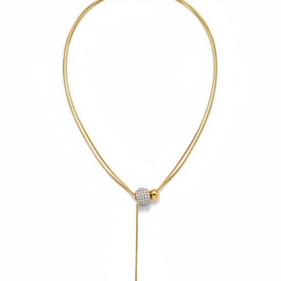 Collar lariat dorado con cuenta pavé y terminal esférico en acero con baño de oro 18K