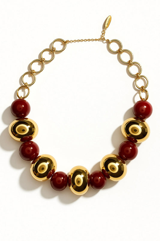 Collar luxury dorado con esferas burdeos y cadena de eslabones redondos