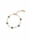 Pulsera dorada con mini discos negros y circonitas, ajustable