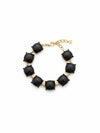 Pulsera dorada con gemas negras cuadradas en talla cushion