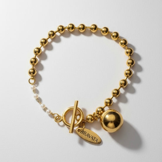 Pulsera Órbita Dorada de esferas con mini perlas y cierre T