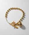 Pulsera Órbita Dorada de esferas con mini perlas y cierre T