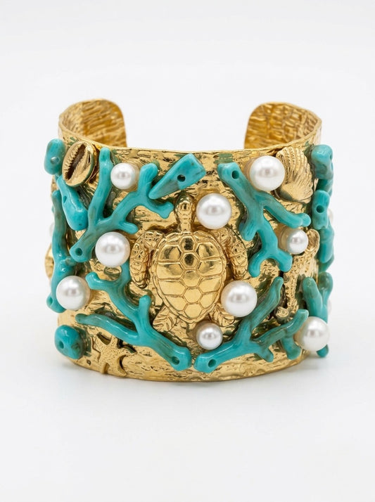 brazalete dorado ancho con tortuga central coral turquesa y perlas estilo marino