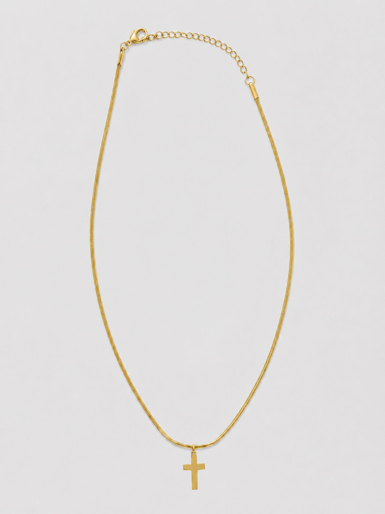 Collar de cruz dorado con cadena fina para mujer