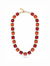 Collar cushion dorado con piedras rojas y naranjas estilo elegante con cápsula de recuerdos opcional Bravata