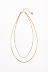 Collar dorado de doble cadena fina estilo minimalista elegante para layering Bravata
