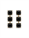 Pendientes largos dorados con piedras negras brillantes. Un diseño sofisticado y versátil ideal para eventos o looks elegantes de noche.