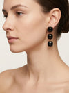 pendientes largos negros elegantes con piedras oscuras y acabado dorado
