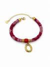 Pulsera Amalfi roja de tejido estampado con detalle central rojo, colgante ovalado dorado y cierre ajustable de BRAVATA.