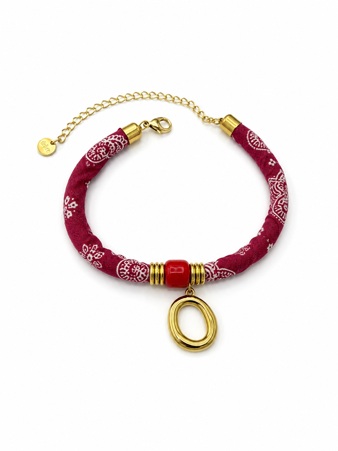 Pulsera Amalfi roja de tejido estampado con detalle central rojo, colgante ovalado dorado y cierre ajustable de BRAVATA.