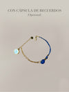 Pulsera azul con cordón y detalles dorados con cápsula de recuerdos opcional Bravata