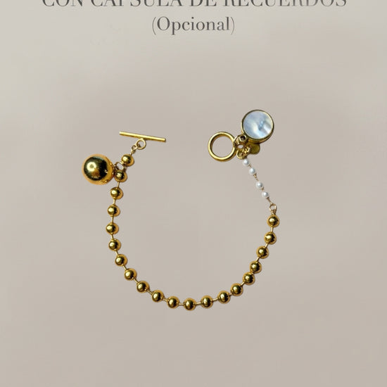 Pulsera dorada con bolas y cápsula de recuerdos opcional Bravata