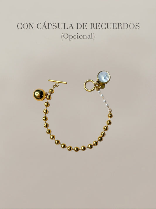 Pulsera dorada con bolas y cápsula de recuerdos opcional Bravata