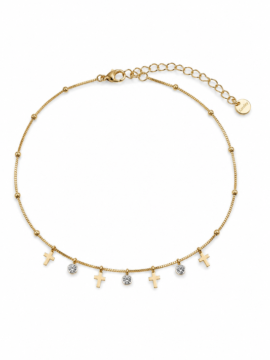 Pulsera Celeste dorada con cruces colgantes, circonitas blancas y cadena ajustable de BRAVATA.