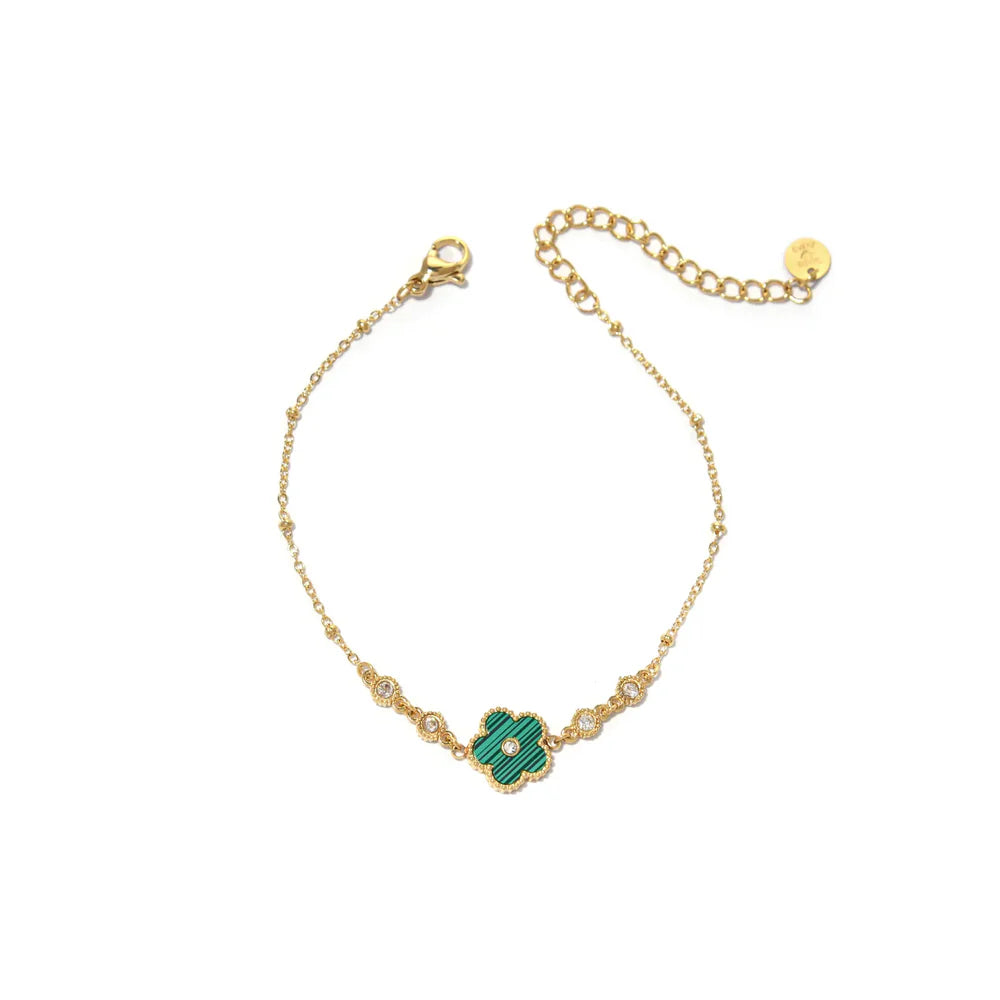 Pulsera dorada con flor verde y circonitas brillantes