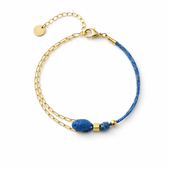 pulsera dorada con piedra volcánica azul y cordón ajustable estilo moderno para mujer