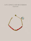 Pulsera roja con cuentas y detalles dorados con cápsula de recuerdos opcional Bravata